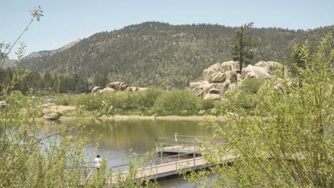 Woman-walking-on-dock-at-Big-Bear-Lake