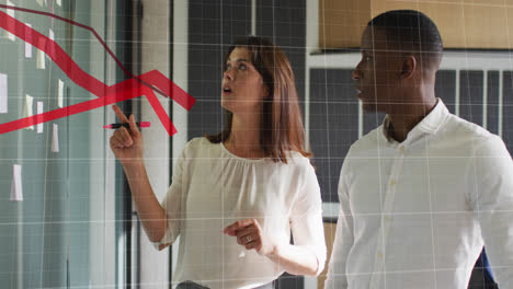 animation of red graphs moving over diverse man and woman discussing over memo notes at office