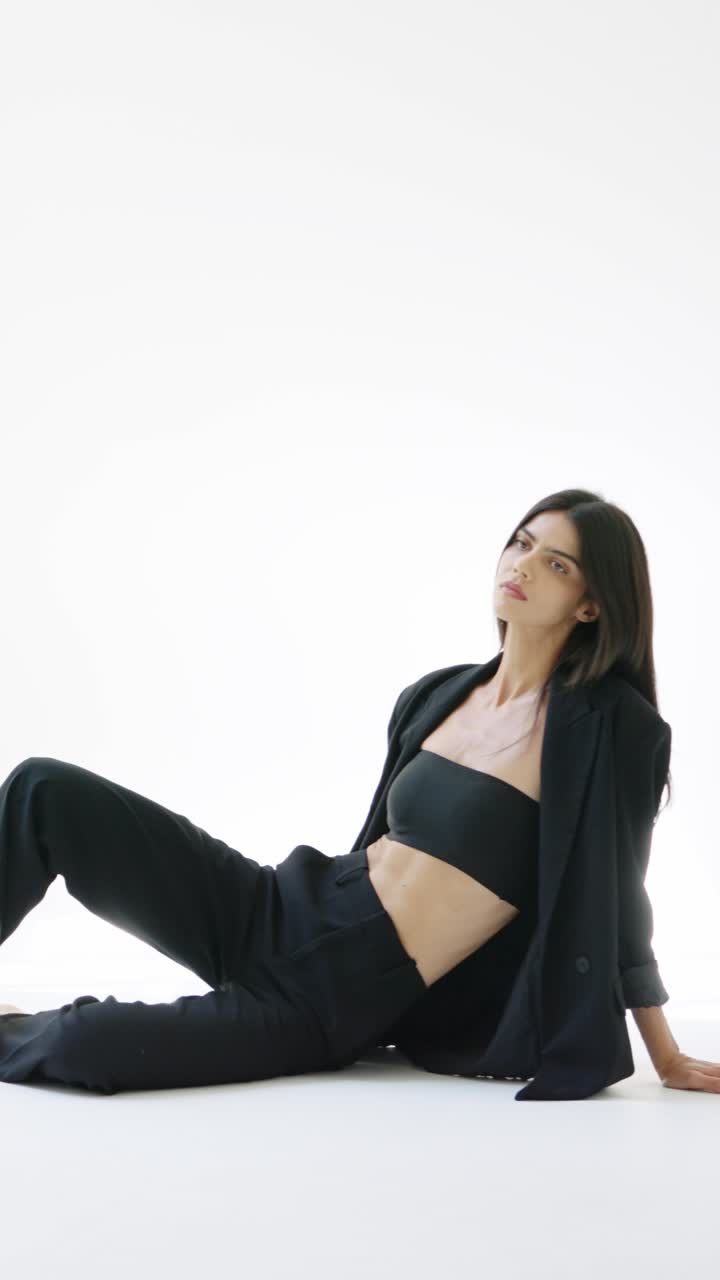 A fashionable woman in a black suit
