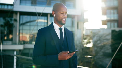 businessman using smartphone on a city bridge