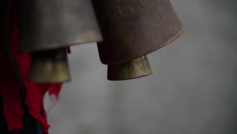 slow motion bouncing of bells part of red bulgarian kuker costume during a traditional dance symbolically to scare the forest ghosts-1