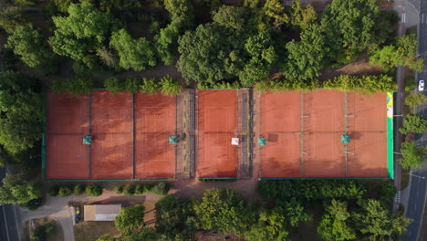 aerial view of tennis courts in a park