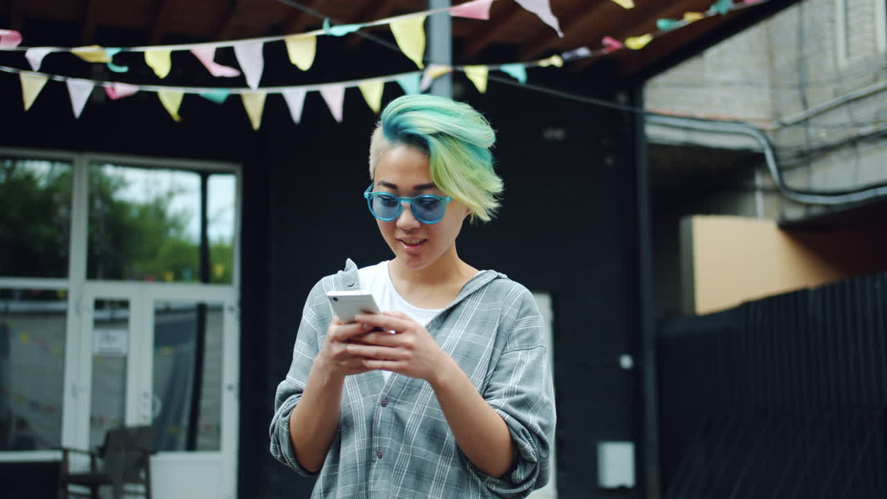 Young Woman Texting Outdoors