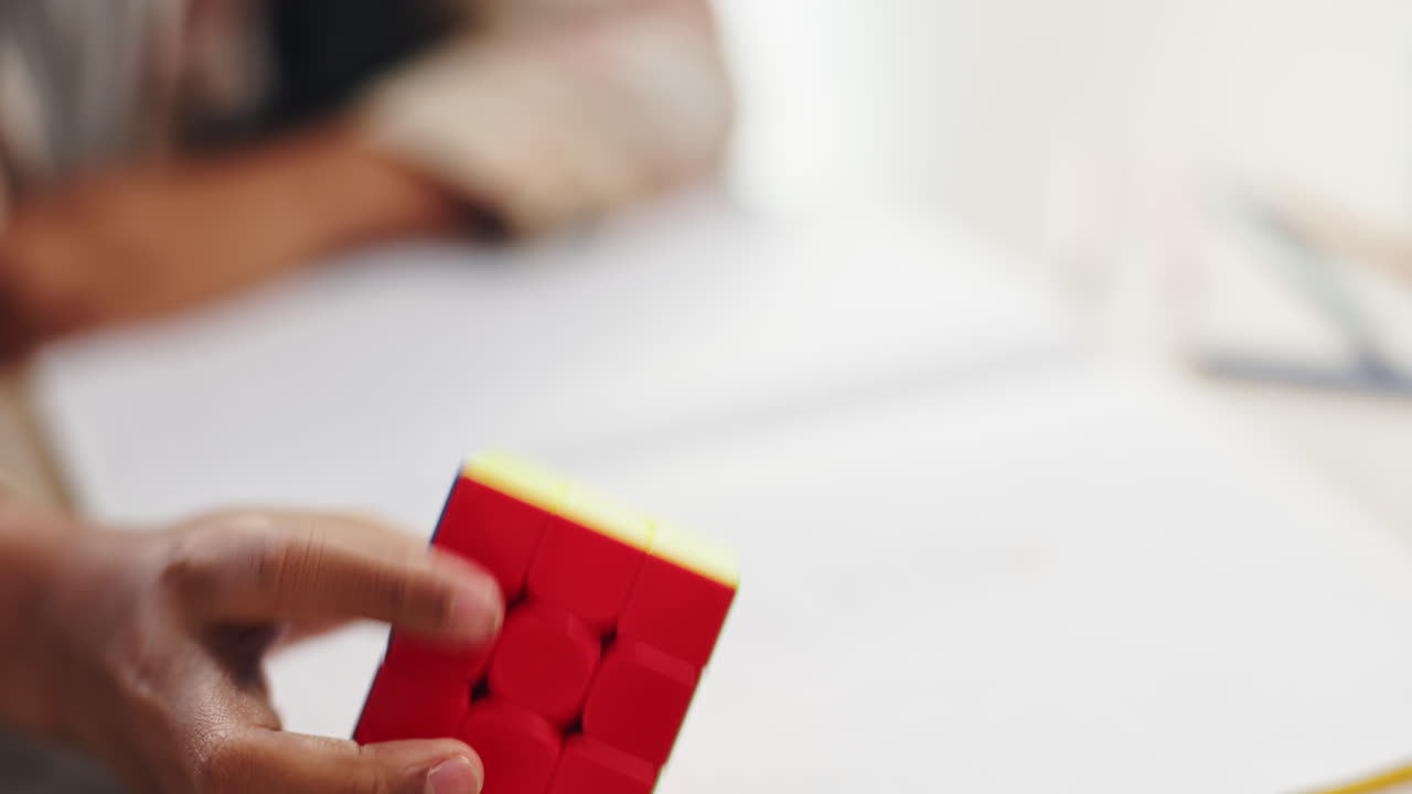 Child solving Rubik's cube