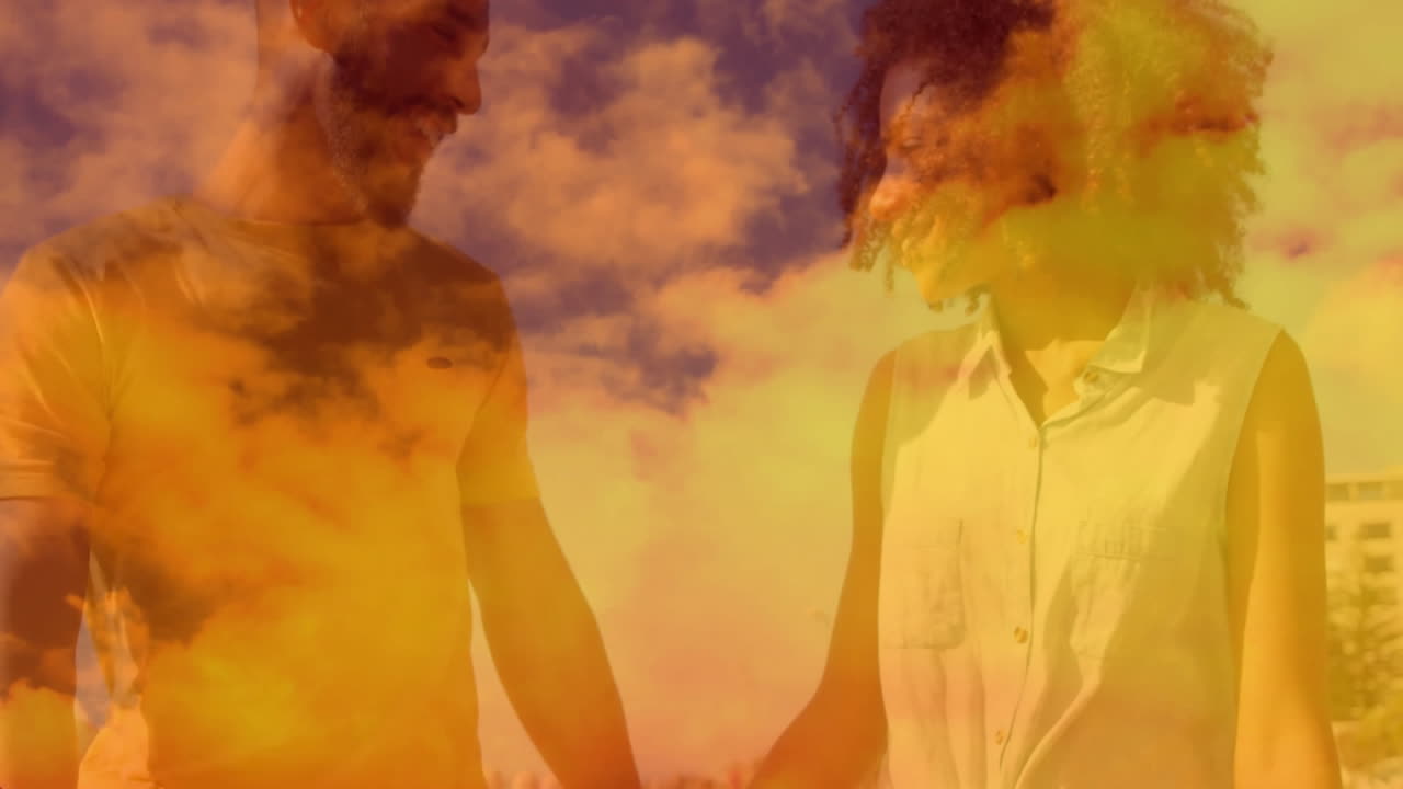 Holding hands, couple standing with vibrant sunset animation in background