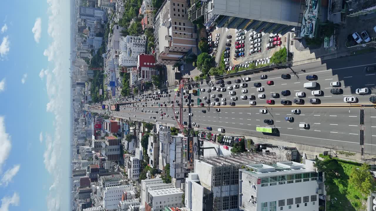 Street traffic in Avenida 27 of February in Santo Domingo. Vertical aerial