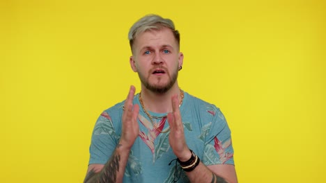 man holding his head in his hands, looking stressed and disappointed