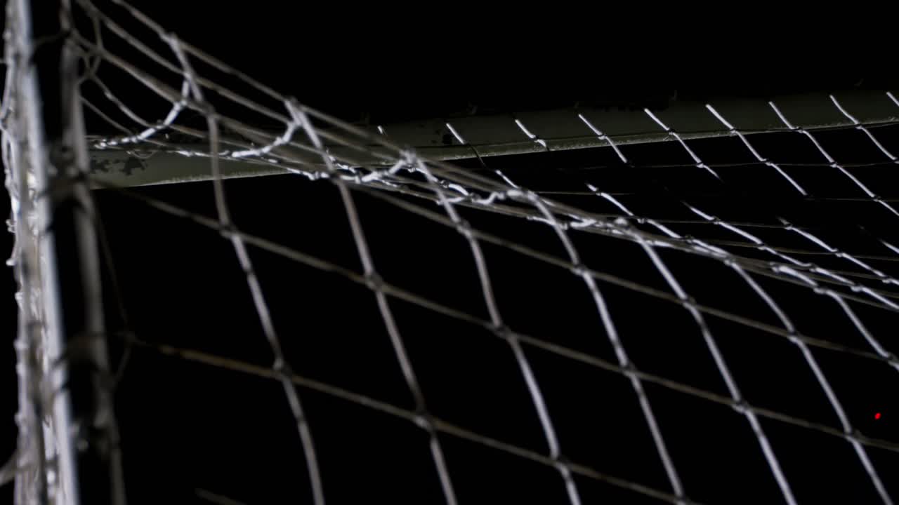 Soccer ball in goal post against goalkeeper 4k