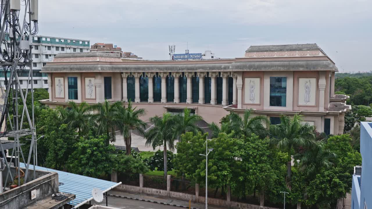 Kalaivanar Arangam Building with three and Signal tower at Wallahjah Road, Anna Salai, Triplicane, Chennai, Tamil Nadu, india. day time stable shot 4k.