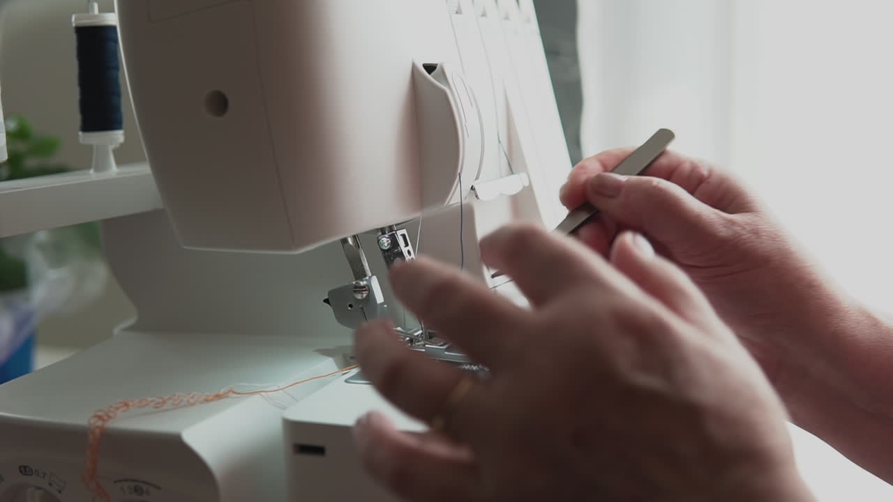 Dressmaker Threading Sewing Machine With Tweezers. Slow Motion