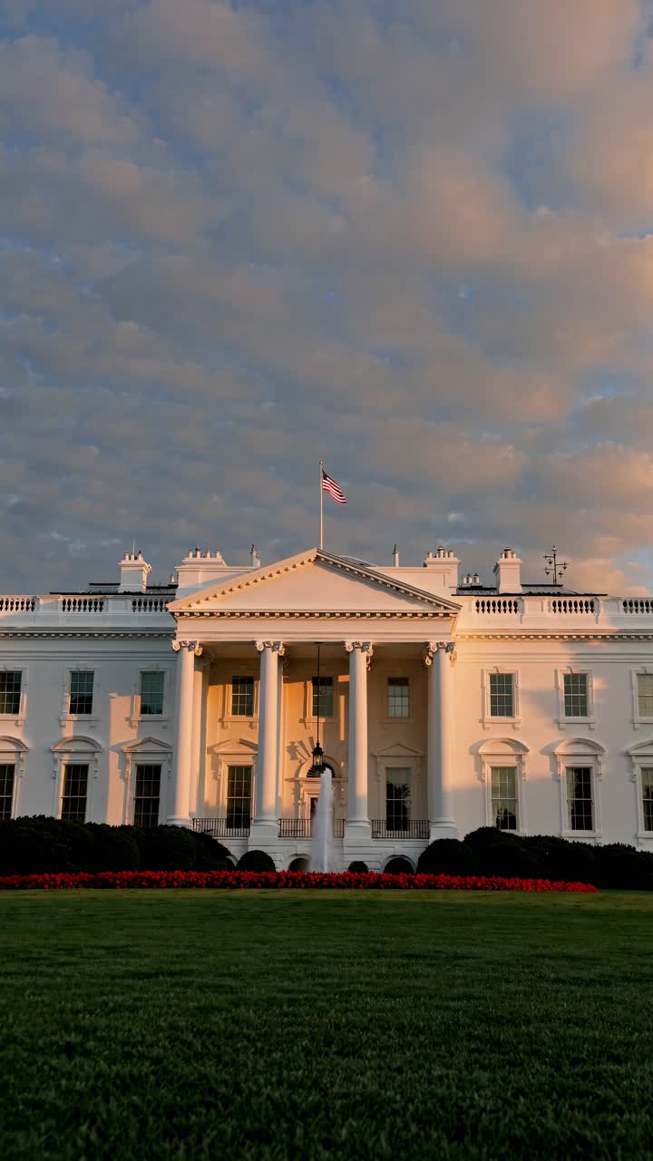 A low-angle video captures the White House at sunset, highlighting its neoclassical architecture