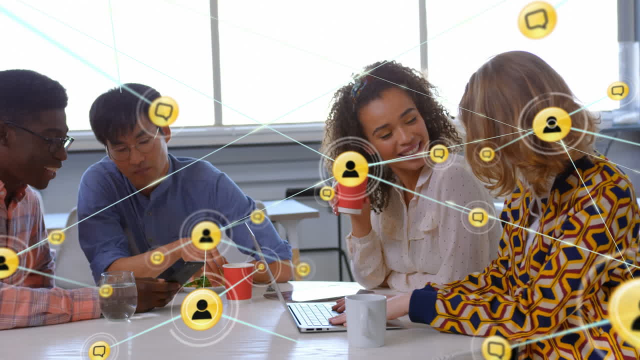 Animation of network of digital icons over diverse colleagues discussing during tea break at office