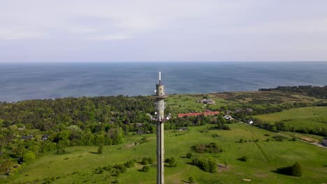 aerial view of a radio tower in skamlebæk, odsherred with the beautiful coastline of sejerøbugten, zealand, denmark