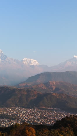 vertical drone shot of the annapurna range from sarangkot hills, sunrise in nepal