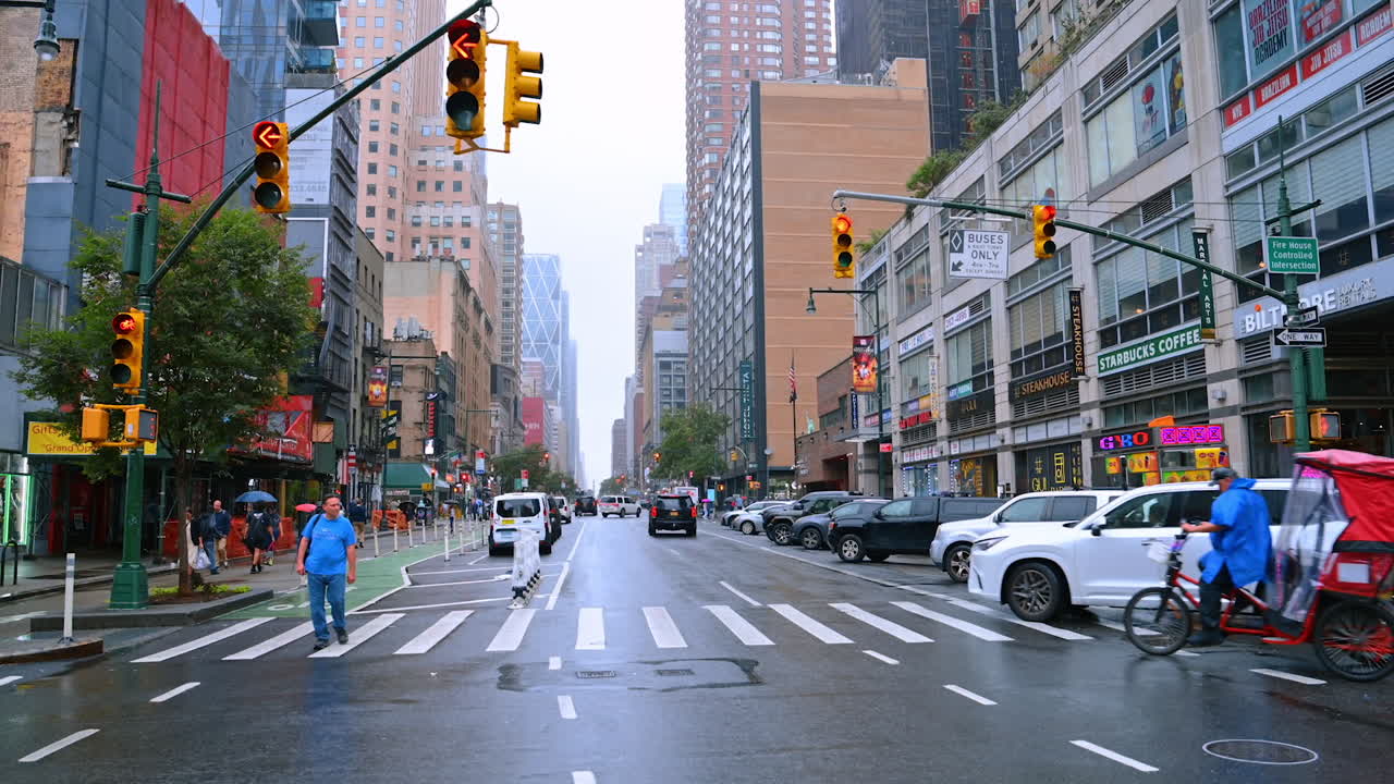 Streets and crossroads of New York with yellow street lights. Traffic on the roads of metropolis at daytime