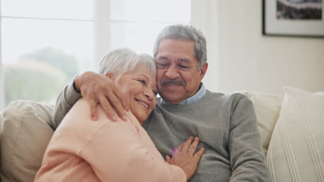 Old-couple,-sofa-and-hug-with-love