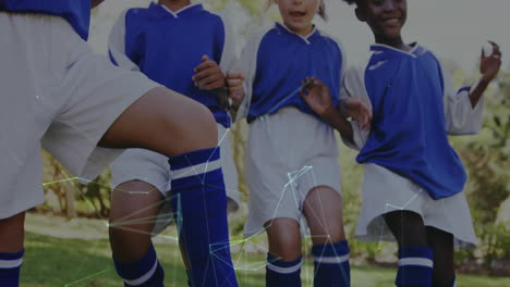 playing soccer, children in blue uniforms with network connections animation over them