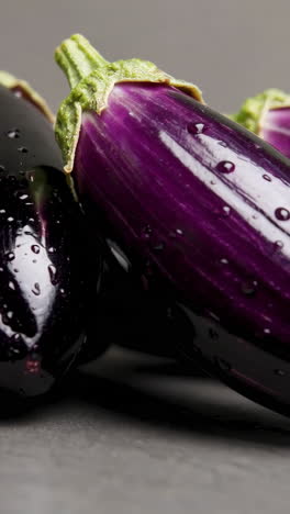 fresh purple eggplants with water droplets