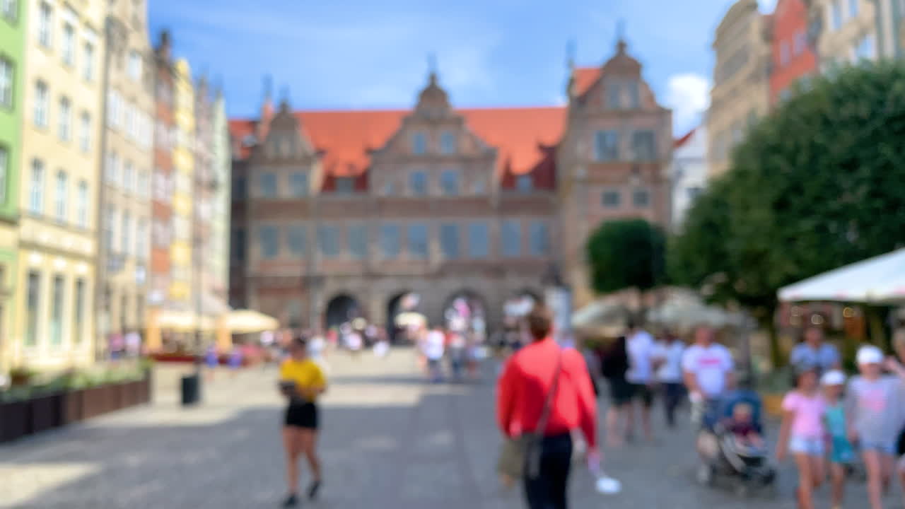 People going on Long Street in Gdansk, blurred footage on ceter of the city, slow motion on Dluga ulica in Gdansk