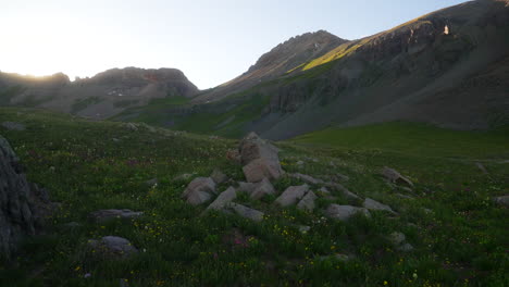 cinematic rocky slider breeze colorful wildflower colombine colorado last dusk sunset golden hour light ice lake basin silverton telluride ouray trailhead top of peak rocky mountains landscape