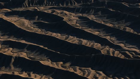 mudstone formations of wavy sharp rocks ridges at factory butte canyon in usa