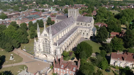 overview drone shot of winchester cathedral and grounds, filmed in summer in hampshire, uk