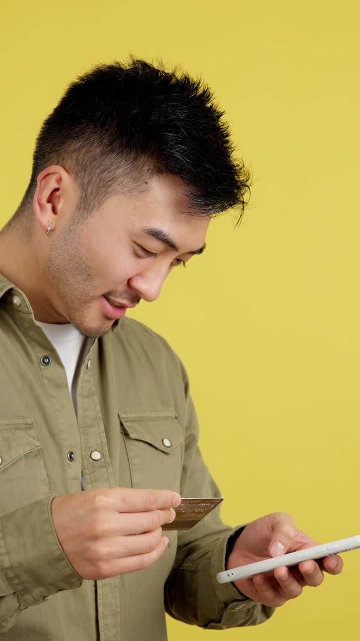Man using credit card and smartphone
