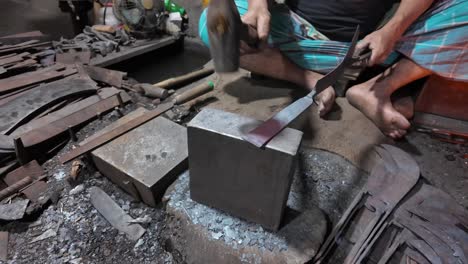 blacksmith working on tools