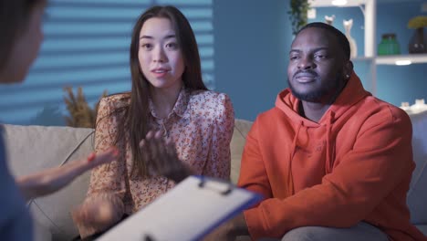 Ethnic young couple are having problems in their marriage or relationship. Different races and ethnicity concept.