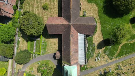 dolly forward straight down over the village church in barham in kent, uk