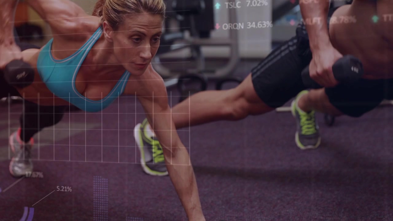 Male starting dumbbell row while female matching from plank on gym carpet, for core, charts showing