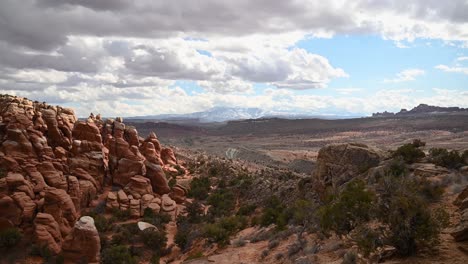 view of the fiery furnance with the la sal mountains in the distance, time lapse