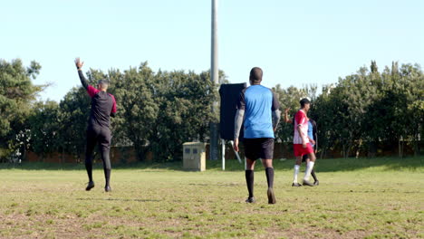 playing soccer on field, boys in sports uniforms enjoying outdoor activity