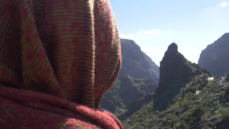 veiled person view of spectacular landscape