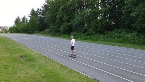 young man in summer clothes skating fast over