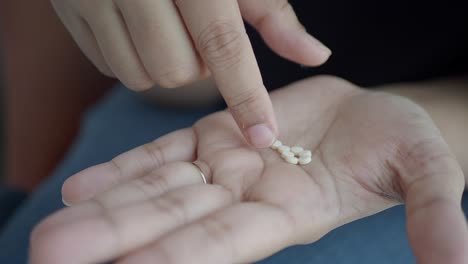 woman taking pills