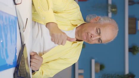 Vertical-video-of-Ambitious-and-determined-portrait-of-home-office-worker-old-man.