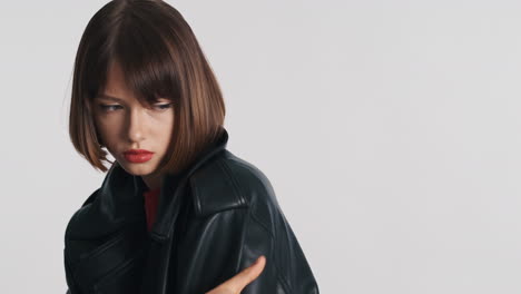 Side-view-of-brunette-woman-in-leather-jacket