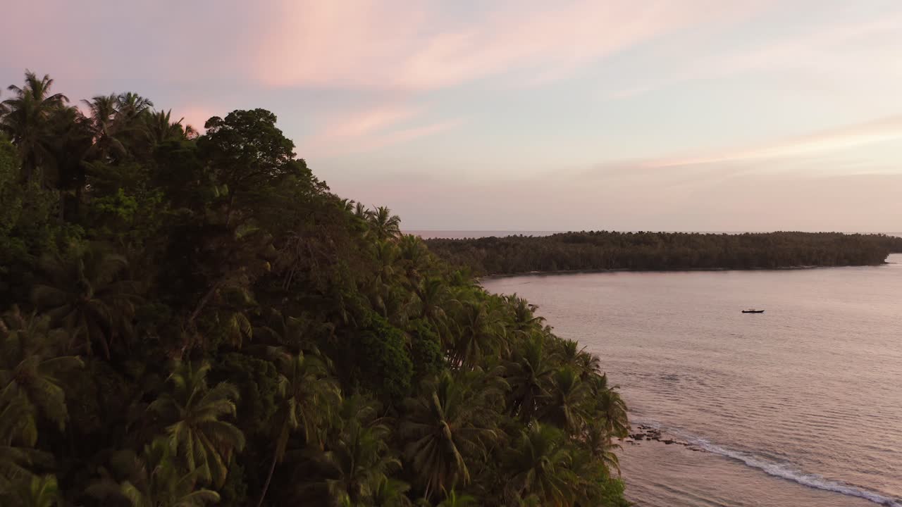 Drone shot of a remote Mentawai islands revealing boats and resorts