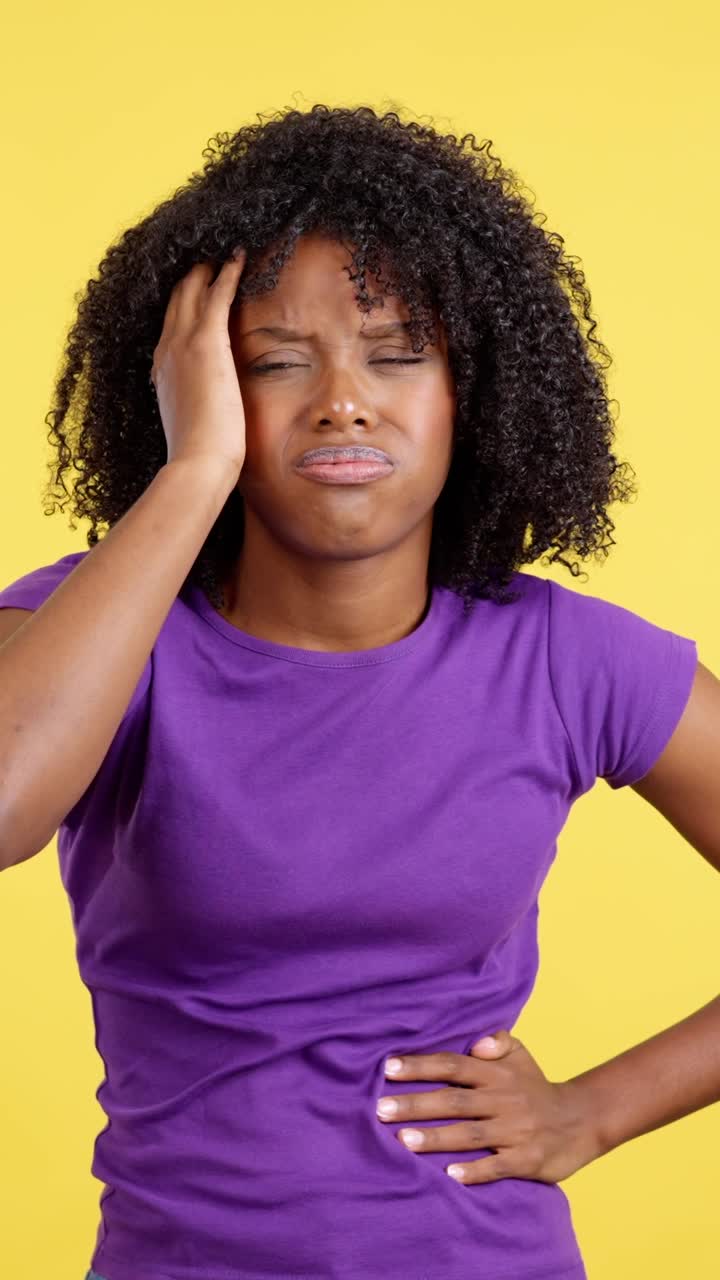 Young African American Woman Expressing Pain and Discomfort