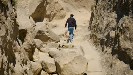 a man climbs in the mountains. selective focus. people.