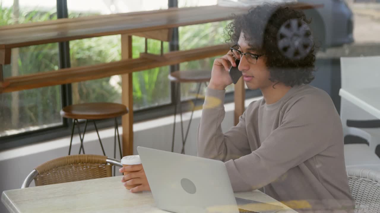 Man talking on mobile phone while having coffee 4k