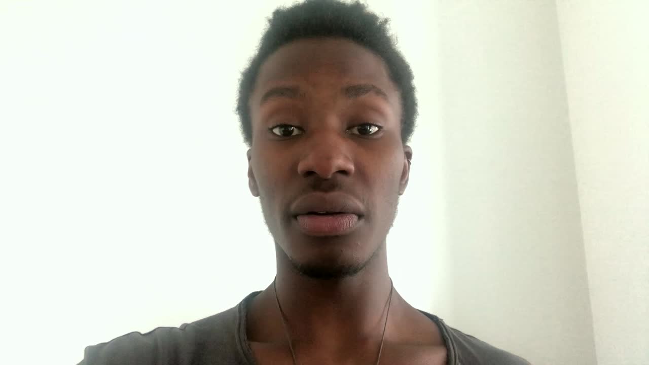 African American Man Giving Bad News Over Video Chat