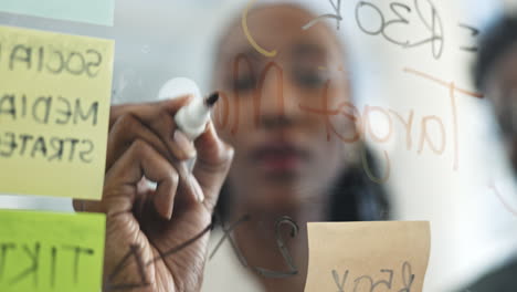 Black-woman,-hands-and-writing-in-schedule