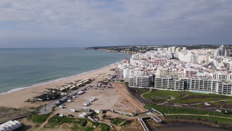 Drone-establisher-white-city-Armacao-de-Pera-in-Portugal,-panorama-view-beach