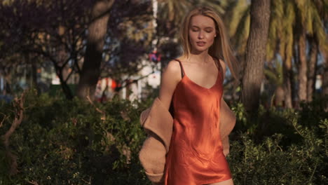 young woman walking outdoors.