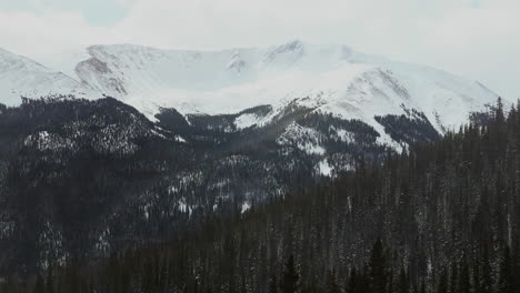 berthoud berthod jones pass winter park snowy winter colorado high elevation aerial cinematic drone parallax rocky mountains peak i70 scenic landscape view hwy 80 roadside national forest right motion
