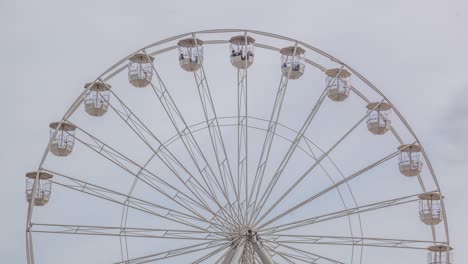 a 4k timelapse of a ferris wheel during an overcast day in bournemouth, dorset, united kingdom.