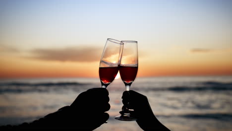 Toast,-champagne-and-hands-silhouette-for-sunset