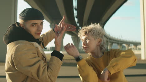 Young-Couple-Dancing-Vogue-on-Street